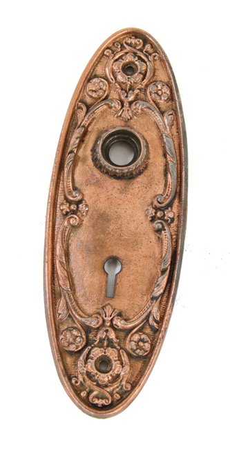 original c. 1900's antique american ornamental copper-plated cast iron oval-shaped doorknob escutcheon or backplate