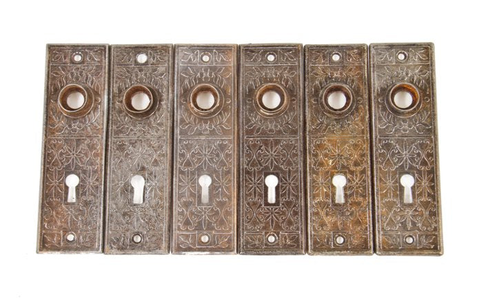 six matching c. 1900's antique american interior residential passage door wrought steel backplates with embossed ornament