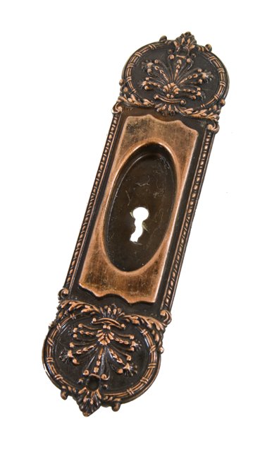 early 20th century american ornamental wrought bronze "de bercy" pattern pocket door escutcheon with single keyhole