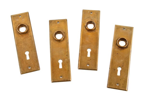 four matching c. 1880's american antique interior residential cast brass doorknob escutcheons with nicely aged surface patina