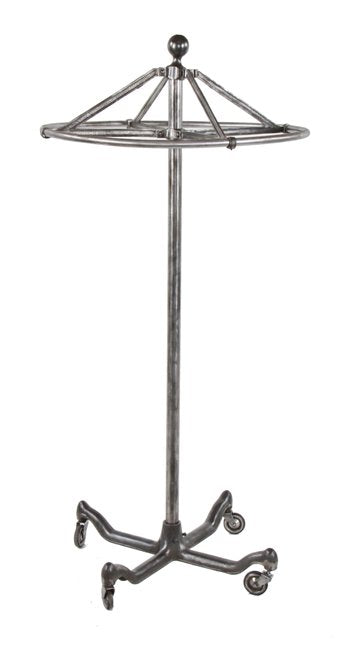 complete early 20th century vintage american made revolving interior department store "dorad" garment rack with weighted cast iron four-legged base