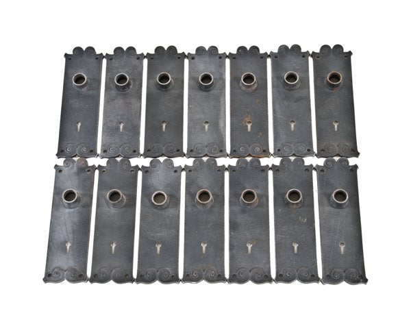 fourteen matching c. 1895 ornamental cast iron interior reliance office building passage door backplates with embossed volute design motifs