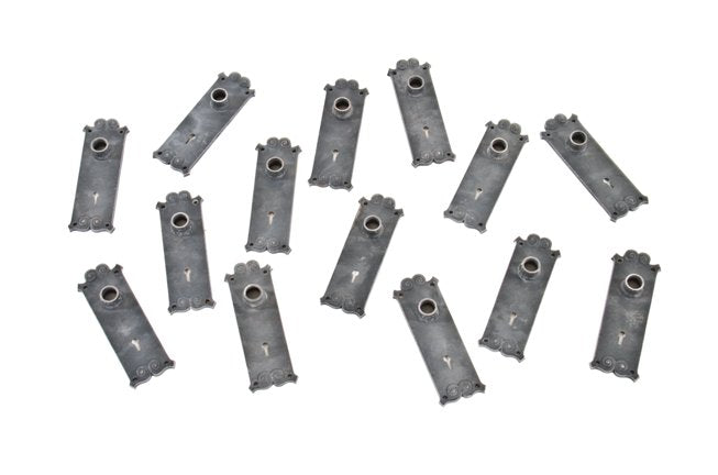 large lot of original c. 1895 ornamental cast iron interior reliance building utility door backplates with original bower-barff finish