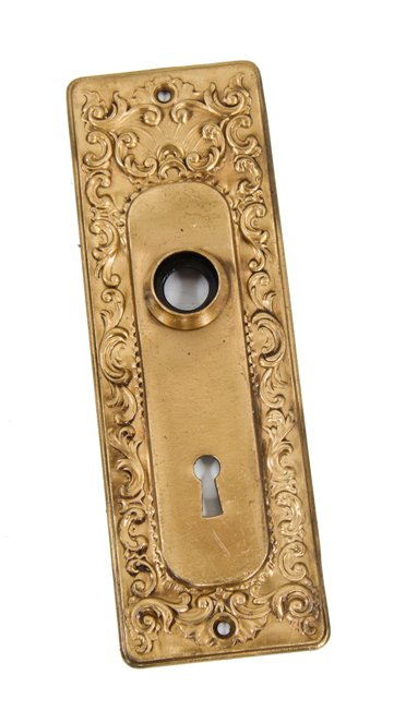 c. 1910-20 american interior residential stamped brass metal passage door backplate with surrounding foliated scrollwork