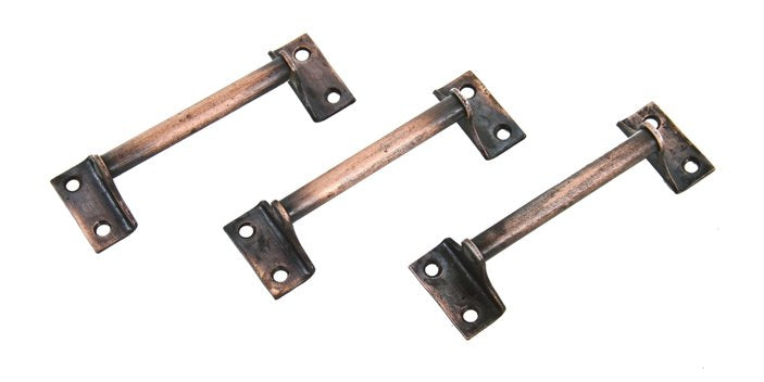 lot of three matching early 20th century unadorned cast iron residential cabinet drawer pulls or handles with copper-plated finish