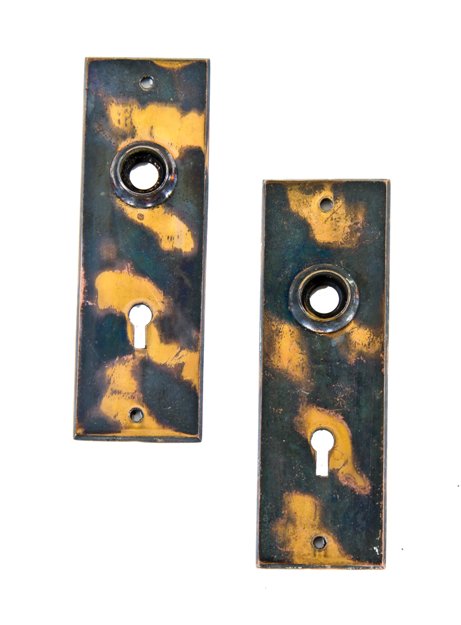 two all original late 19th century american unornamented cast brass residential passage door backplates with oxidized copper finish