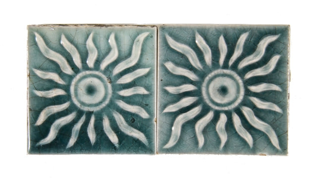 pair of original 19th century american antique teal colored majolica glazed fireplace tiles with radiating sun design motifs