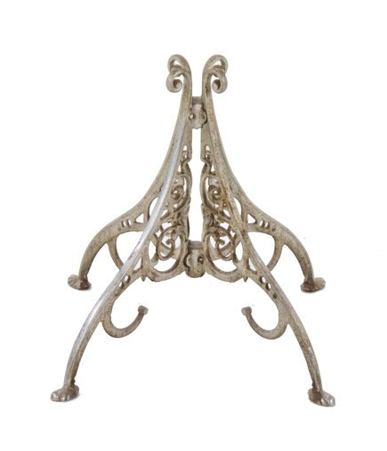 intact 19th century american four-legged cast iron barbershop coat rack base with claw feet and abundant scrollwork