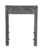 19th century black enameled ornamental cast iron interior residential fireplace summer cover surround with full-bodied cherubs