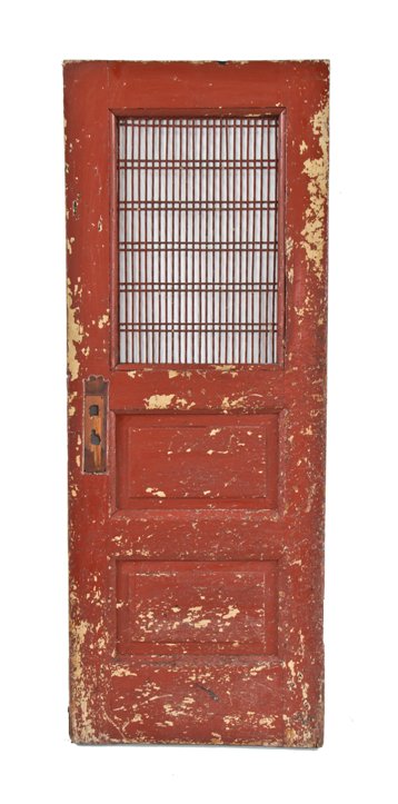 original and nicely distressed late 19th century painted mahogany wood reliance building raised panel utility door with overlapping wire mesh screen