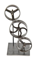 repurposed vintage american industrial tabletop display stand featuring three refinished spoked machine shop pulleys