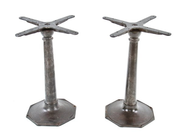 intact c. 1900's tapered and turned refinished cast iron pub table bases with octagonal-shaped floor plates