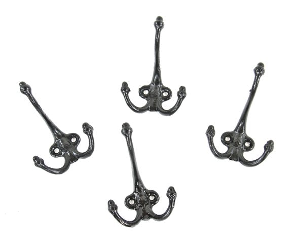 four matching original early 20th century antique black enameled ornamental cast iron interior residential acorn finial closet coat or hat hooks