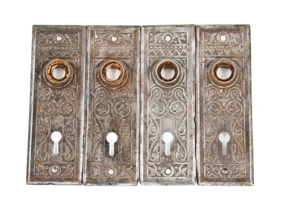 lot of four matching c. 1910-20 american antique pressed and stamped steel residential passage door backplates with brushed metal finish