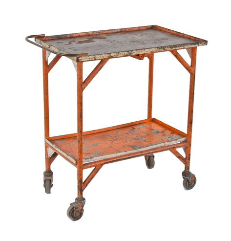 late 1940's vintage american industrial two tier distressed orange enameled mobile factory supply cart with intact swivel casters