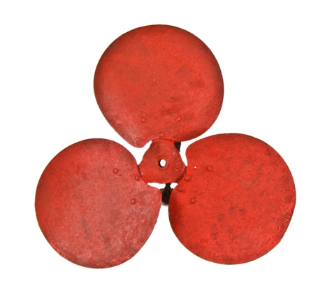 old weathered and worn american industrial mechanical riveted joint steel three-blade fan assembly with red paint finish