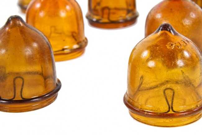 large lot of original and intact dark amber colored mold-blown american antique depression-era "reco" theater marquee sign light bulb hoods with internal steel clamps