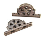 matching pair of original early 1870's american industrial ornamental cast iron residential sliding door floor track single groove rollers