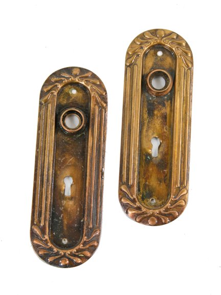 matching set of original late 19th century antique american ornamental rounded edge residential passage door backplates
