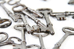 variety of original antique american residential stamped steel mortise lock skeleton keys with lightly incised manufacturer markings