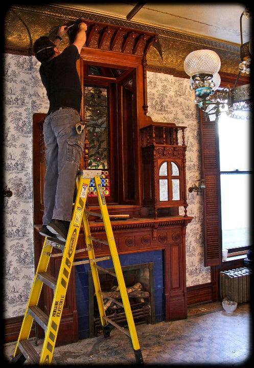 original extraordinary 19th century american hand-crafted david c. cook mansion cherry wood fireplace mantel featuring segmented beveled mirror hinged door cabinets