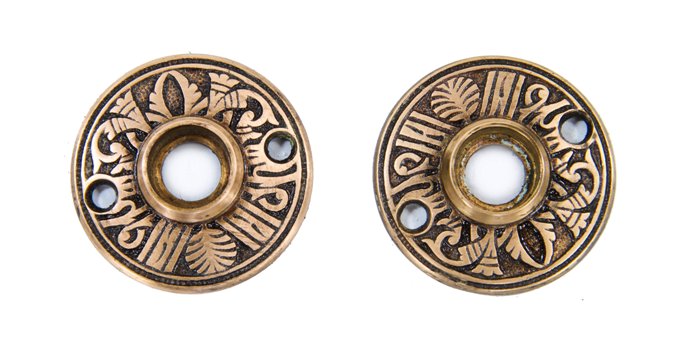 matching set of original c. 1885 american eastlake style ornamental cast brass "egyptian" pattern residential doorknob rosettes
