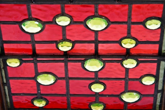 remarkable c. 1886 original and intact david c. cook mansion interior sidelight stained glass window with multiple "uranium" glass faceted jewels