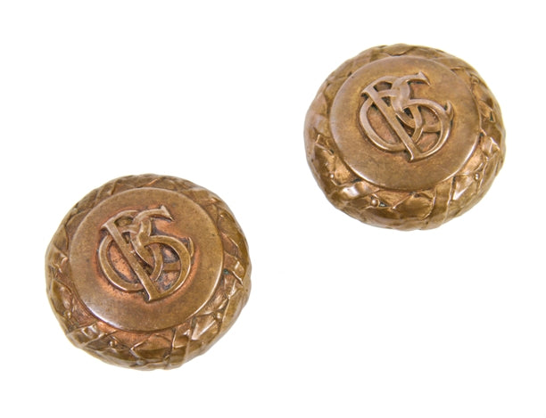matching set of c. 1893 interior downtown chicago old colony building office door monogrammed cast brass doorknobs with bayleaf border