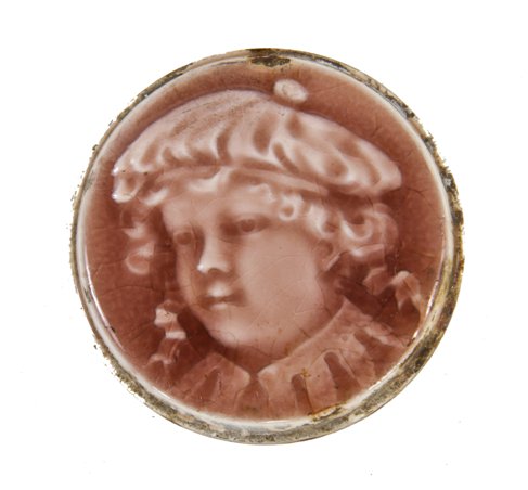 authentic 19th century american victorian era majolica glazed circular portrait stove tile depicting a young costumed child