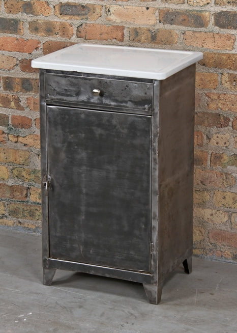 refinished american late 1920's vintage medical cold-rolled steel stationary hospital examination room supply cabinet with white porcelain tabletop
