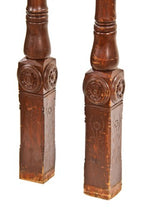 matching pair of skillfully crafted c. 1886 american victorian era solid cherry wood interior room divider or colonnade columns with impressive carved ornament