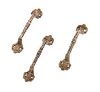 group of three matching 19th century american victorian era ornamental cast brass interior residential window sash pulls or lifts