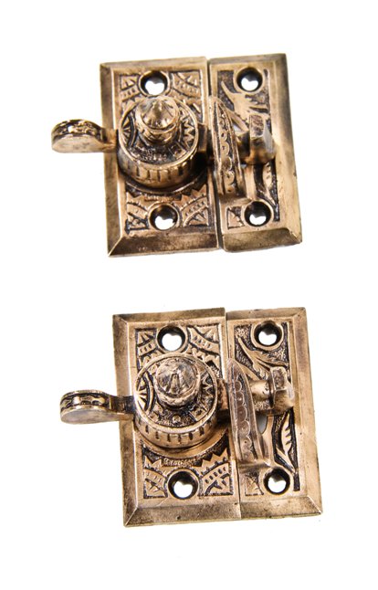 set of 19th century american interior residential eastlake style "oriental" pattern fully functional cast brass sash locks with matching keepers