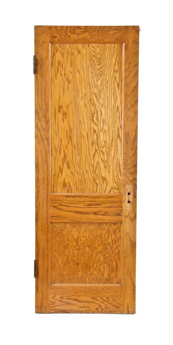 well-maintained early 20th century american golden oak two recessed panel interior residential passage door with ball finial hinges