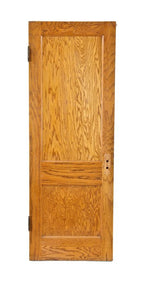 well-maintained early 20th century american golden oak two recessed panel interior residential passage door with ball finial hinges