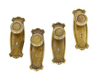 original early 20th century american interior residential craftsman style stamped yellow brass doorknob and matching escutcheons
