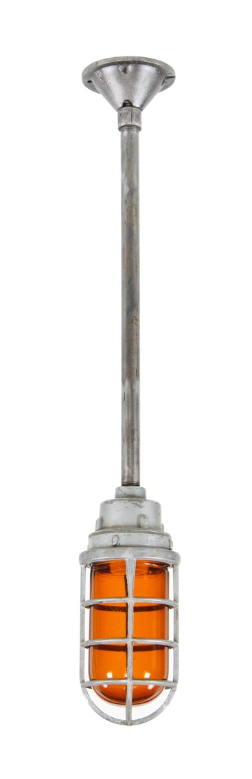 american industrial single electric "explosion proof" ceiling mount pendant light with unique amber-colored pressed glass globe