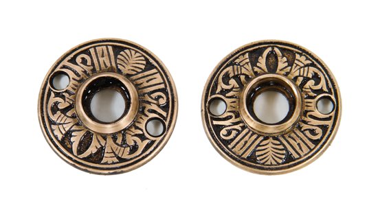 two matching late 19th century original american eastlake style "egyptian" pattern ornamental cast brass passage doorknob rosettes