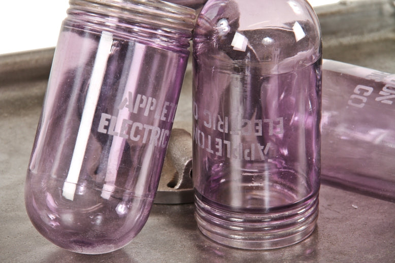 pair of matching rare c. 1914 american industrial "sun purple" explosion proof threaded end bulb guards with lightly etched lettering