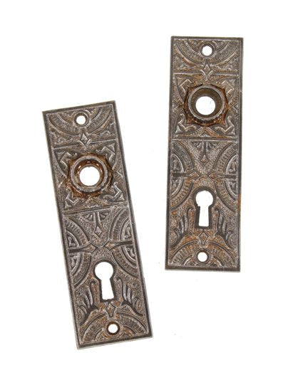 two matching late 19th century american victorian era ornamental cast iron doorknob backplates with fluted thimbles or collars