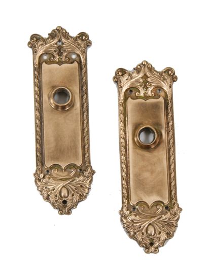 matching set of original early 20th century american antique "chatham" pattern interior residential ornamental cast bronze doorknob backplates