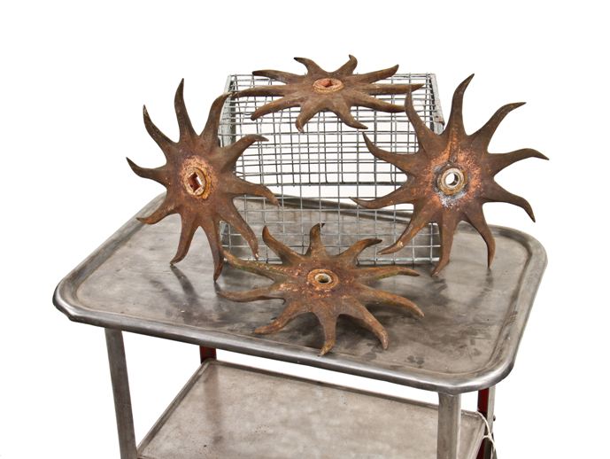 group of matching american vintage industrial rustic cast iron uniquely shaped farm threshing machine or combine rake wheels