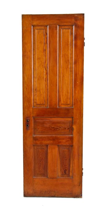 early 20th century original and intact american made interior residential varnished pine wood passage door with five raised panel configuration