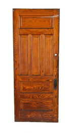 skillfully crafted early 20th century oversized american antique interior residential vestibule oak wood raised panel door with "loriane" pattern escutcheon