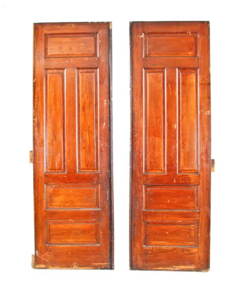 original and intact oversized early 20th century american made varnished oak wood raised panel interior residential sliding pocket doors