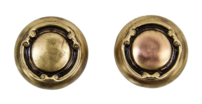 two matching interior residential c. 1910-20 wrought ornamental stamped brass passage size doorknobs with sunken center surrounded by volutes