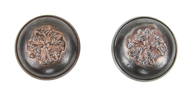 set of original antique american interior residential ornamental cast iron passage size doorknobs with centrally located deeply embossed floral swirl motifs