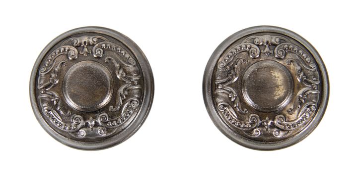 matching set of original american antique ornamental pressed or stamped steel "holland" pattern interior residential doorknobs with oversized centrally located buttons