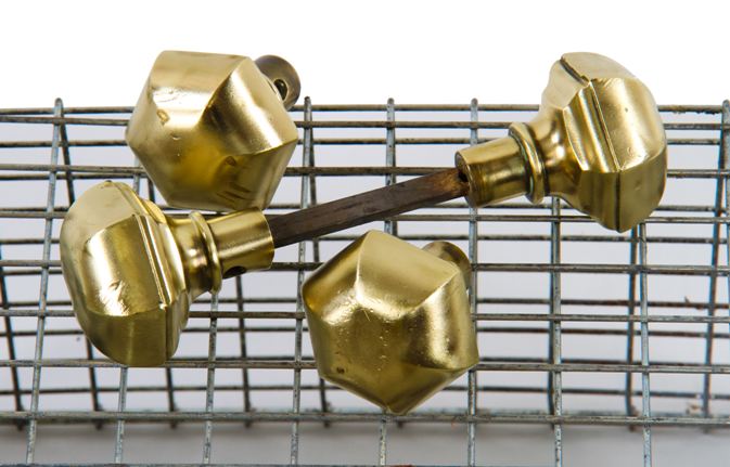 group of four matching early 20th century craftsman style chicago bungalow interior passage door hexagonal-shaped cast brass doorknobs
