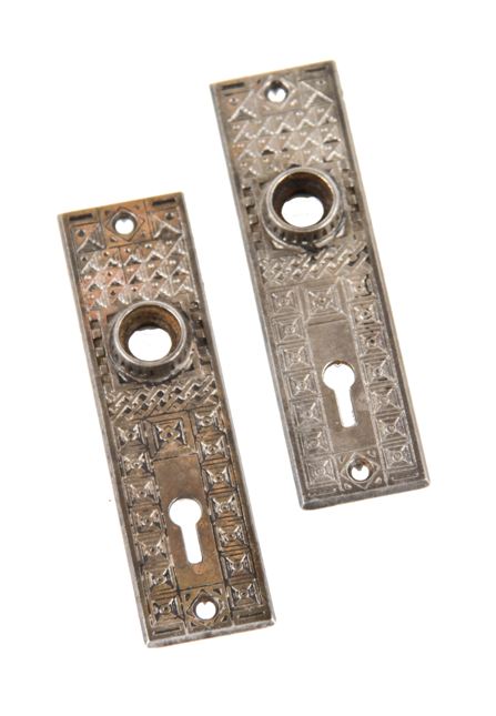 pair of late 19th century american antique interior residential ornamental cast iron passage door backplates with strongly geometric design motifs